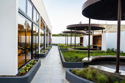 a building with a row of plants inside of it at Cerca del Estadio Nacional Sabana Núcleo Apartamento 'Casa Bientenveo' in San José