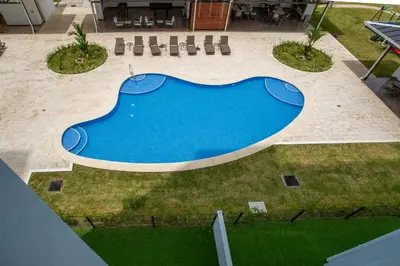 an overhead view of a blue swimming pool at Viva Jaco II in Jacó
