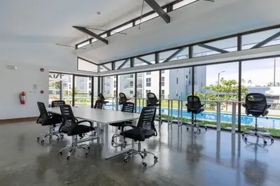 a conference room with a table and chairs at Viva Jaco II in Jacó