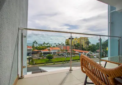 a balcony with a view of a city at Viva Jaco in Jacó