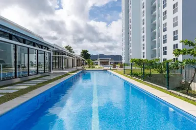 an empty swimming pool in front of a building at Viva Jaco II in Jacó
