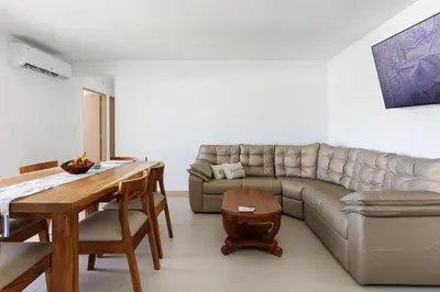 a living room with a couch and a table at Viva Jaco II in Jacó