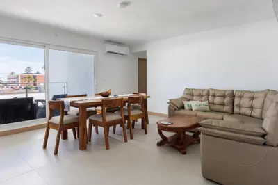a living room with a table and a couch at Viva Jaco II in Jacó