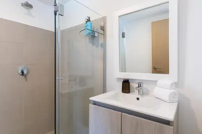 a bathroom with a sink and a shower at Viva Jaco II in Jacó
