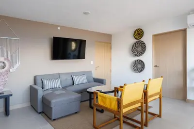 a living room with a couch and a table at Viva Jaco in Jacó