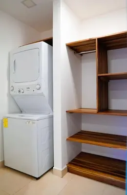 a laundry room with a washer and dryer at Blue 2BR 2BA 10 Min Beach Walk in Nosara