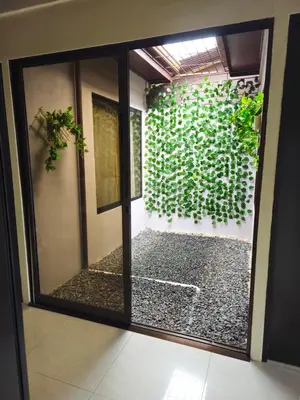 a room with a window with a green wall at Geo'S House & Volcan View in Fortuna
