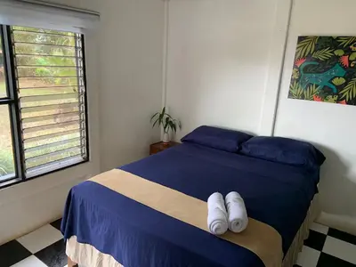 a bedroom with a bed with two towels on it at Hotel Monte del Mago in Carrillos