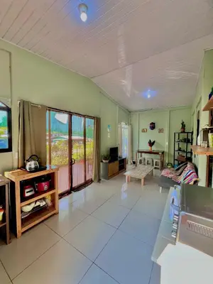 a large living room with a television and a couch at Casa mariposa in Uvita