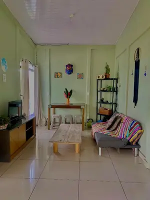 a living room with a couch and a table at Casa mariposa in Uvita