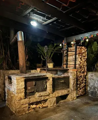 an outdoor brick oven with a pipe on it at Cabaña de Montaña 9per Aire Fresco & Naturaleza in Trojas