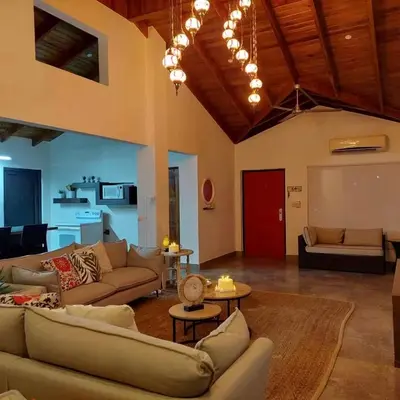a large living room with couches and a table at Casa Nosara a 10 minutos de las playas en auto in Nosara