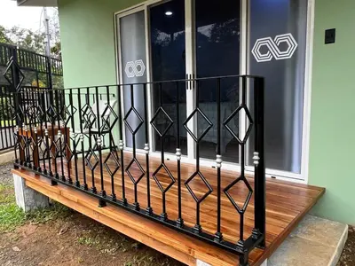 a porch with a bench in front of a window at Villa Binomio in Naranjito