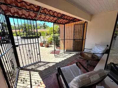 a room with an open door to a patio at Casa Serena! in Coco