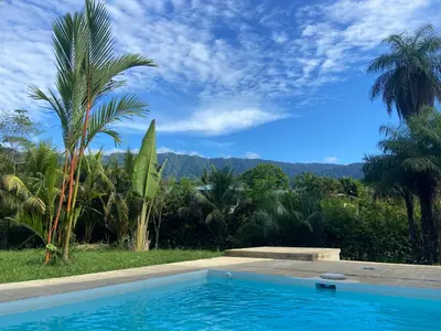 a swimming pool with a view of the mountains at La Casa Mokarran in Ojochal