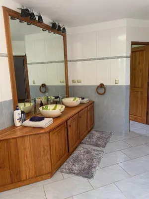 a bathroom with three sinks and a large mirror at Roma del mar - Vila s bazénem a krásným výhledem na moře in Paquera