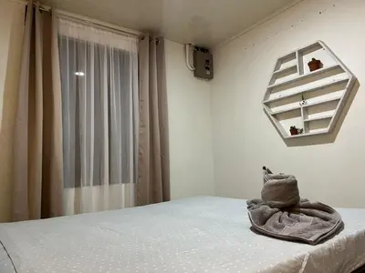a bedroom with a bed with a towel on it at Casa de Campo Nara in Fortuna
