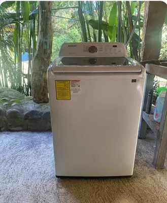 a small white refrigerator sitting on the floor at Cabaña nido de amor escondida en la naturaleza in San Francisco