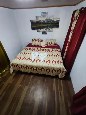 a bedroom with a bed in a room at Cabaña nido de amor escondida en la naturaleza in San Francisco
