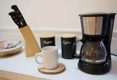 a coffee maker and a coffee mug on a counter at Galeon House in San Rafael