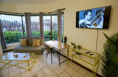 a living room with a couch and a table at Galeon House in San Rafael