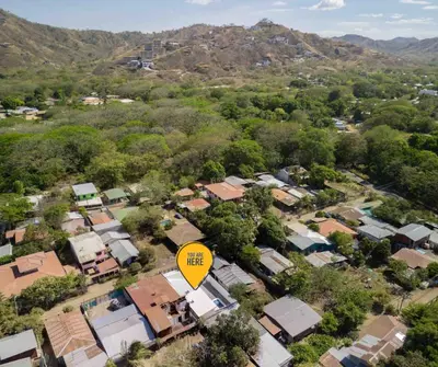 an aerial view of a small village with a yellow street sign at Casa Aurora with Private Patio & Pool in Coco