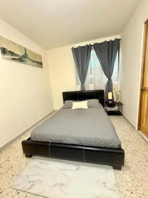 a bedroom with a bed and a window at Beautiful loft in San José in San José