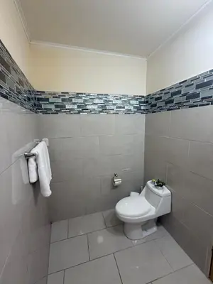 a bathroom with a white toilet in a room at Beautiful loft in San José in San José
