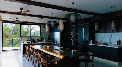 a large kitchen with a large wooden counter top at Villa Cielo Sueños in Carrillo
