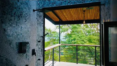 a room with a glass door and a balcony at Villa Cielo Sueños in Carrillo