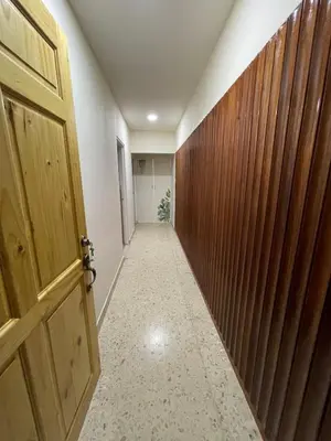 an empty hallway with a wooden door and a corridor at Mini-apartment located in the heart of San José in San José