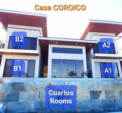 a house with a sign in front of it at Casa Coroico Infinity Pool BBQ Sunset Views in Santa Cruz
