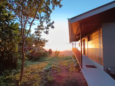 a house with a view of a forest at Finca Alta Vista Monteverde in Monteverde Costa Rica