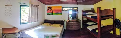a room with two bunk beds in a room at Paradise in Puntarenas