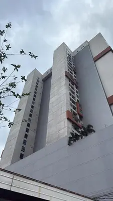 a large building with two tall buildings at Apartamento Vista 11 URBN Escalante in San José