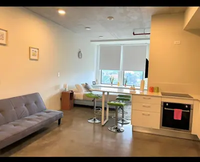 a living room with a couch and a table at Apartamento Vista 11 URBN Escalante in San José
