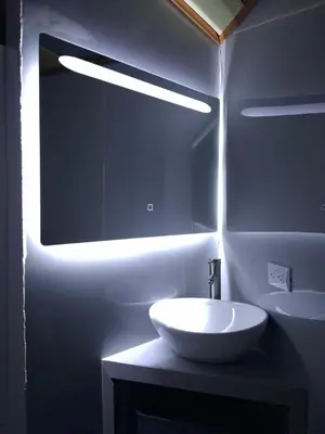 a bathroom with a sink and a large mirror at Cabinas Kai in Quepos