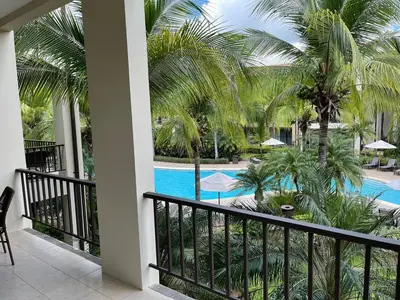 a view of the pool from the balcony of a resort at Luxury Pacifico 3 Bedroom 2 Bath with 300 Mbps WI-FI in Coco