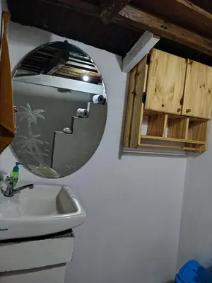 a bathroom with a mirror and a sink at Cabins river blue in Rio Celeste
