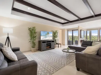 a living room with two couches and a tv at Stunning Spacious Luxury Condo 5-Star Reserva Conchal - Carao in Playa Conchal