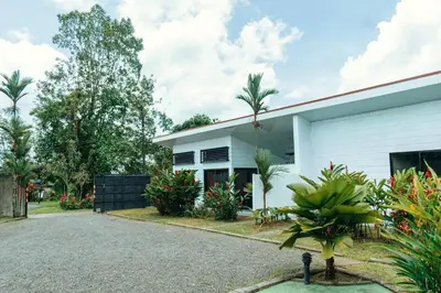 a house with a driveway in front of it at Arenal View Villas in Fortuna