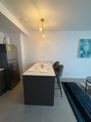 a room with a table with wine glasses on it at Excellent location, beautiful apartment in San José