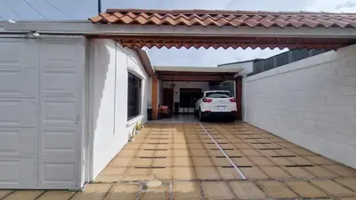 a car parked in the garage of a house at Apartamento Adriana in Cartago