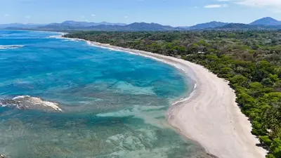 an aerial view of a beach and the ocean at Santa Teresa Manzanillo Walk to Beach, New Home, Center of Tranquil Town in Boca de Ario
