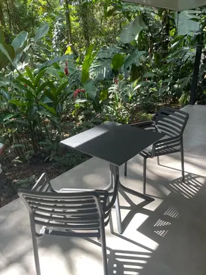 two chairs and a table and a table and chairs at Colibri Jungle Casita in Dominical