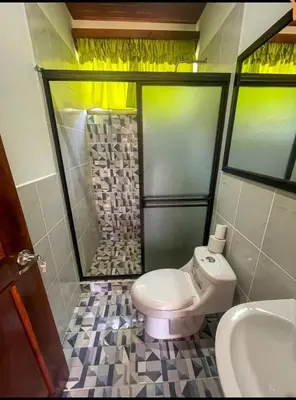 a bathroom with a toilet and a shower and a sink at Casa Jicaro in Nosara