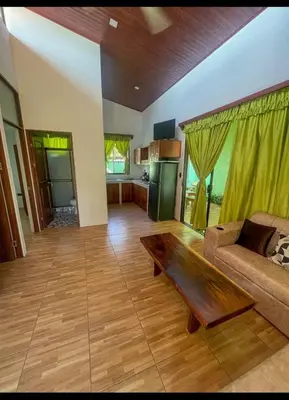 a living room with a couch and a coffee table at Casa Jicaro in Nosara