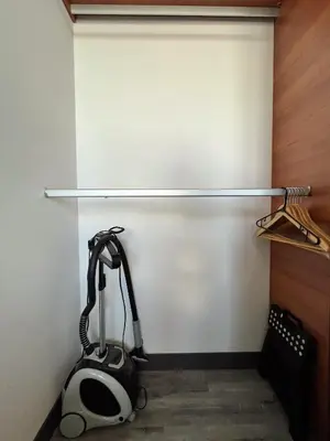 a treadmill in a room with a wall at Lux at 15, Pool, Gym and Stylish City Stay in Hatillo