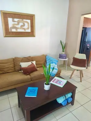 a living room with a couch and a coffee table at Garza Real in Coco