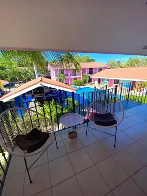 two chairs and a table on a balcony at Garza Real in Coco
